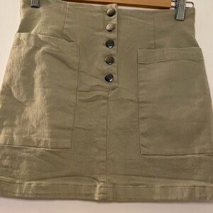 MI AMI short skirt size M, celery green, front button closure.  97% cotton.